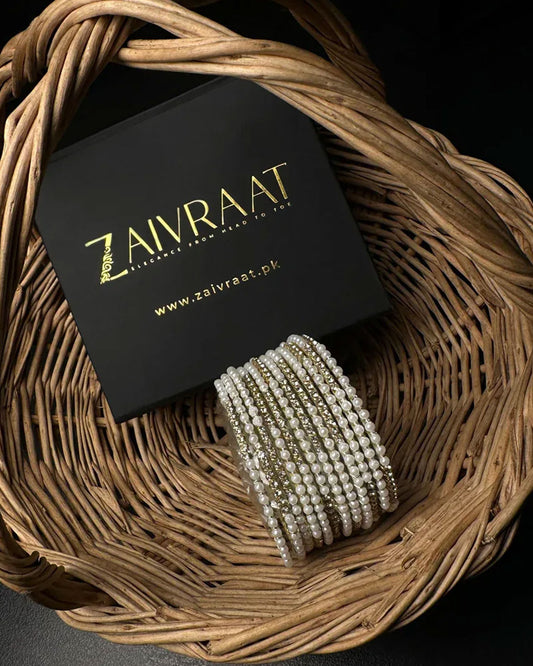 Pearl bangle with golden stones