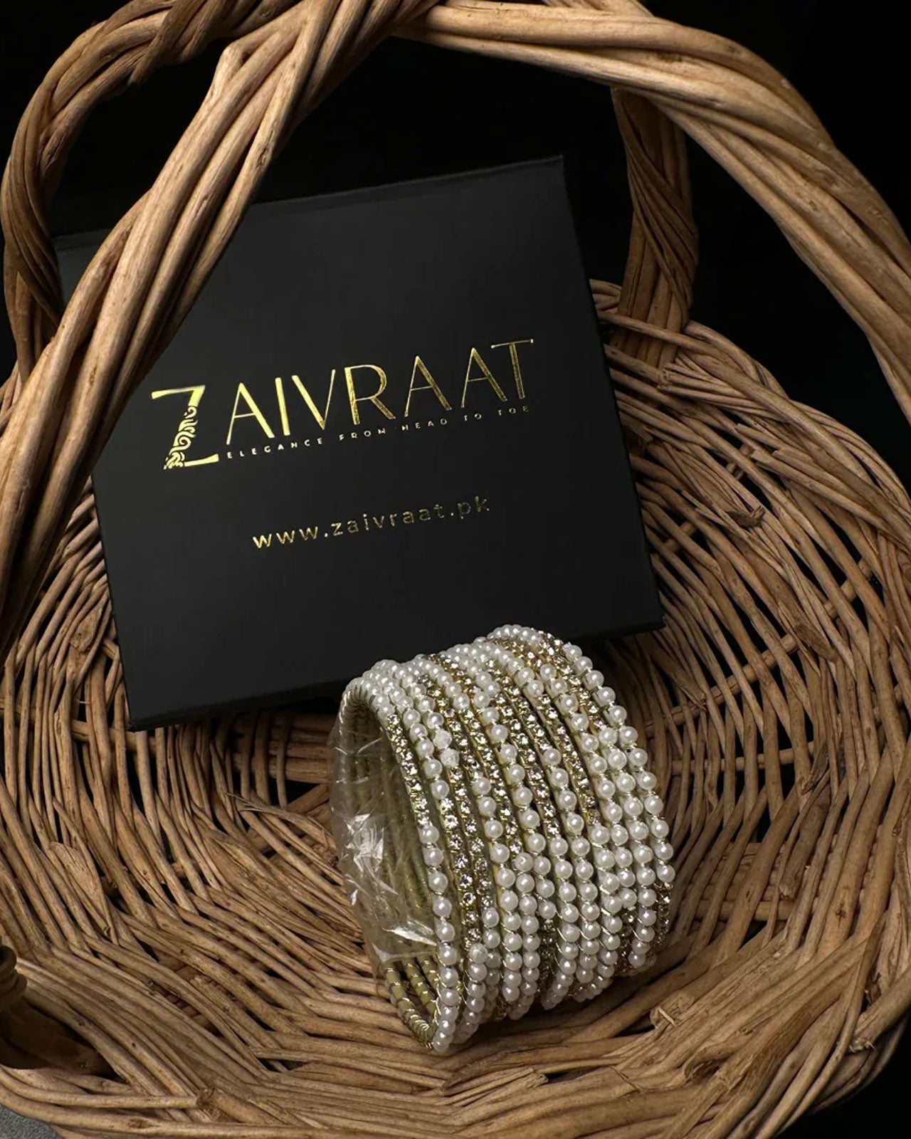 Pearl bangle with golden stones