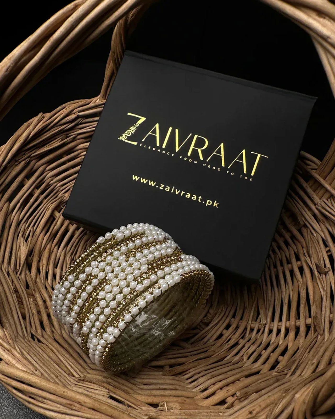 Pearl bangle with golden stones