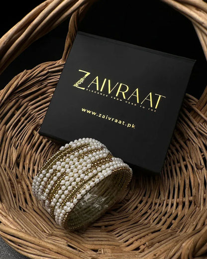 Pearl bangle with golden stones