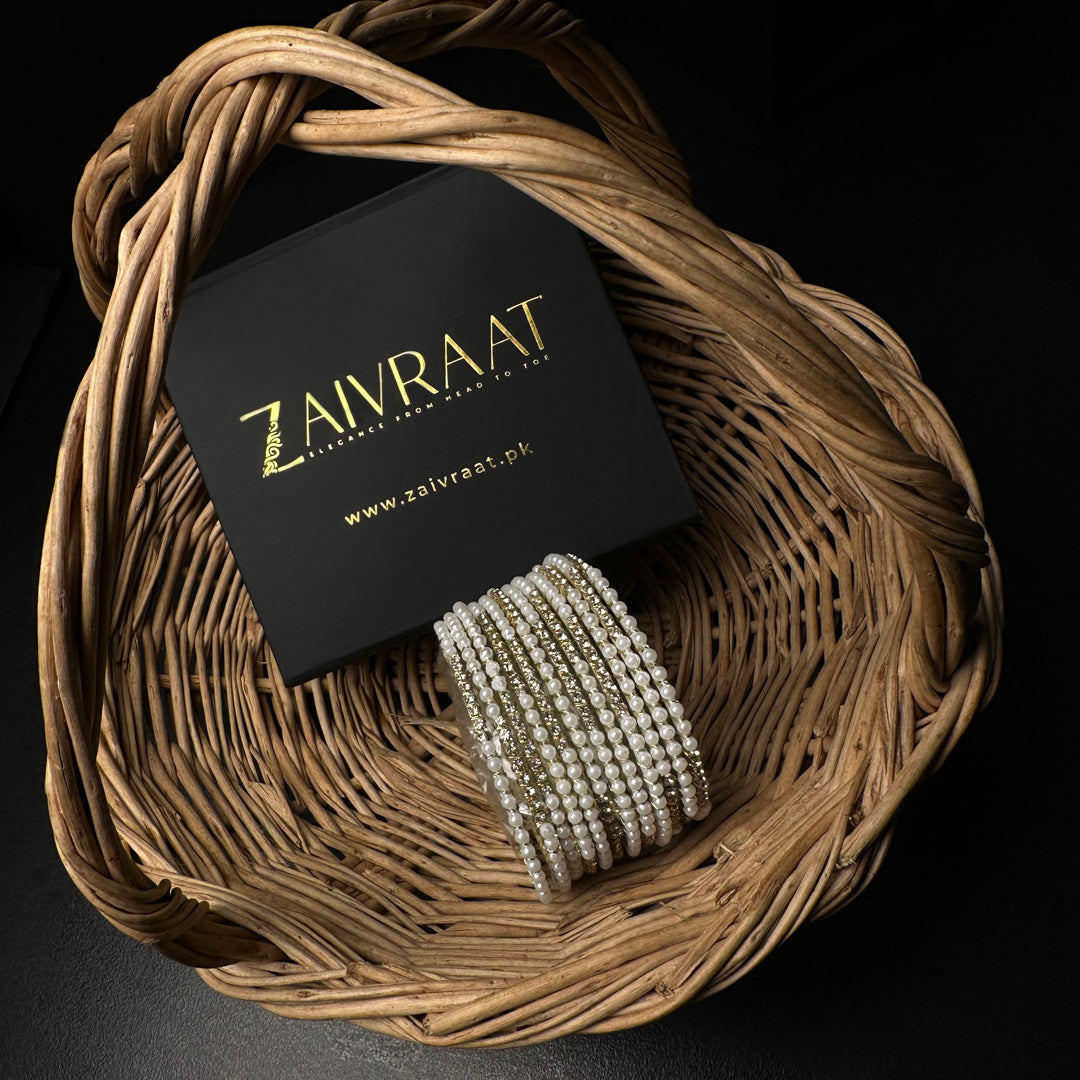 Pearl bangle with golden stones