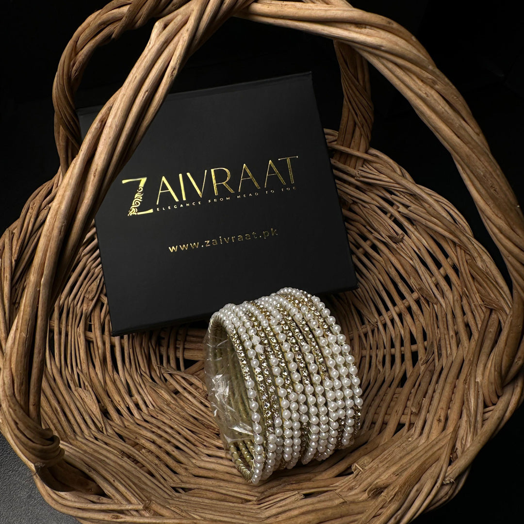 Pearl bangle with golden stones