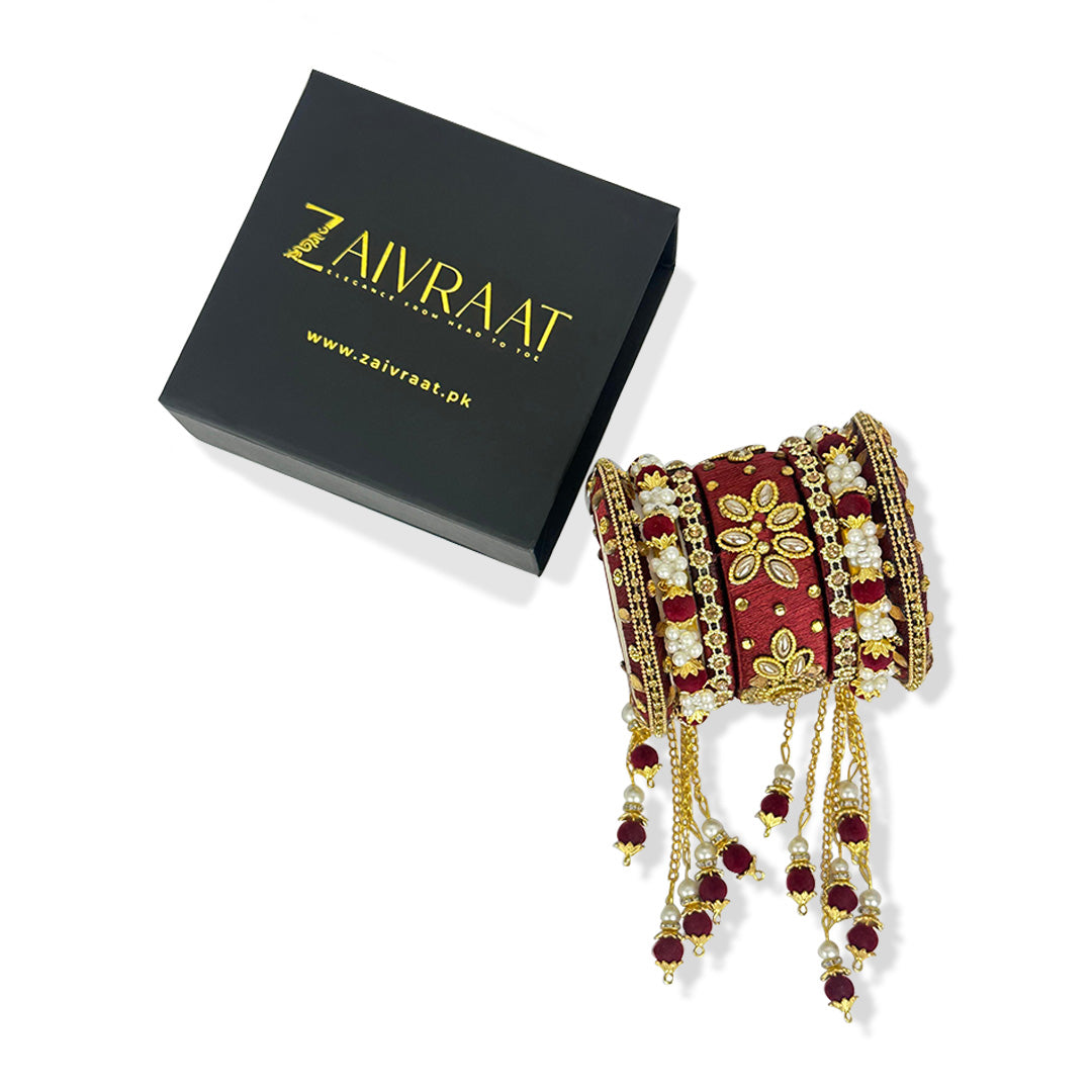 Traditional fancy bridal bangles in maroon with gold lace
