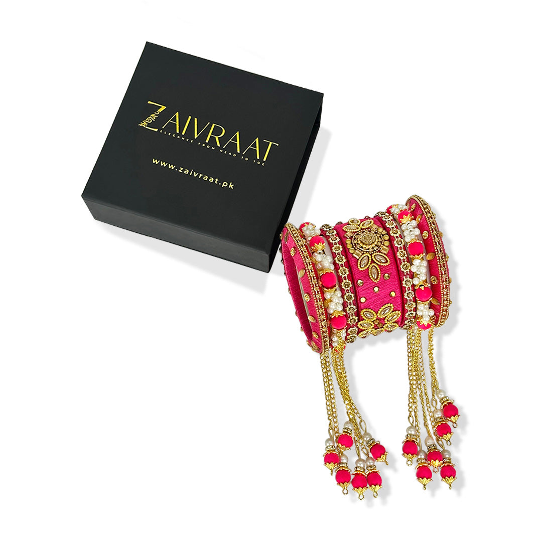 Traditional fancy bridal bangles in pink with gold lace