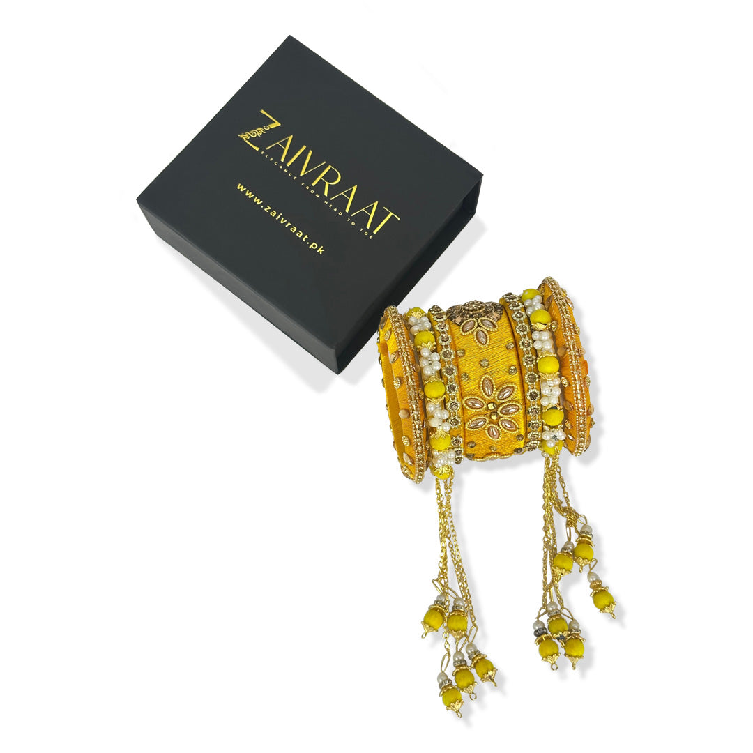 Traditional fancy bridal bangles in yellow with gold lace